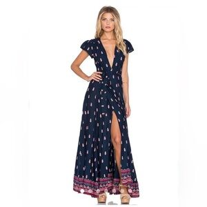 The Sid Wrap Floral Dress by Tularosa in Navy. Size S.